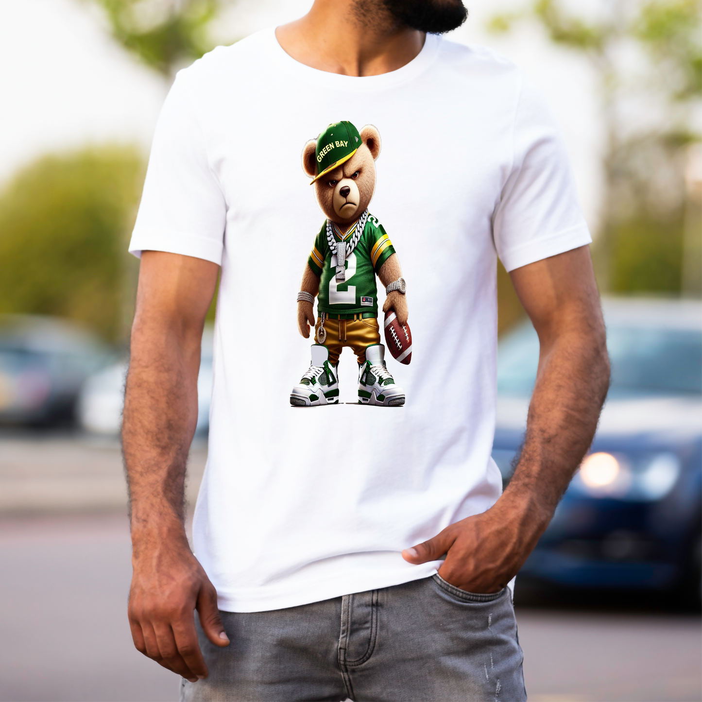 Person wearing a white t-shirt with a Green Bay bear graphic in sports attire.